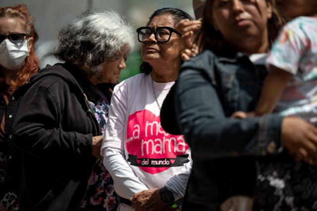 Migrant mothers attend a mass service during Mother's Day at the Mexico-US border in Playas de Tijuana, Baja California state, Mexico on May 10, 2026. (Photo by Guillermo Arias / AFP)