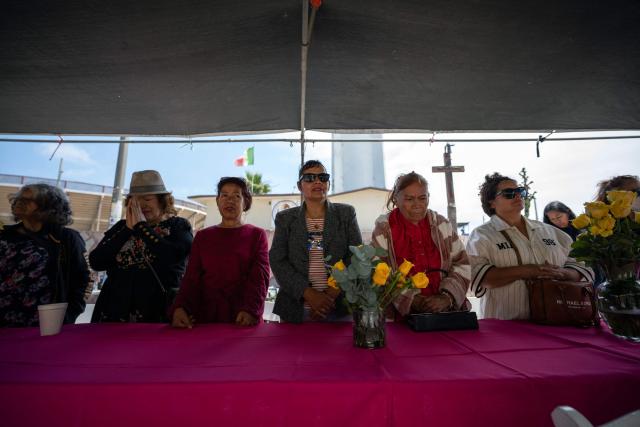 Migrant mothers attend a mass service during Mother's Day at the Mexico-US border in Playas de Tijuana, Baja California state, Mexico on May 10, 2026. (Photo by Guillermo Arias / AFP)