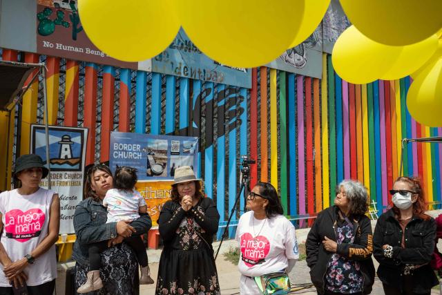 Migrant mothers attend a mass service during Mother's Day at the Mexico-US border in Playas de Tijuana, Baja California state, Mexico on May 10, 2026. (Photo by Guillermo Arias / AFP)