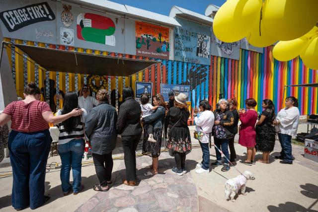 Migrant mothers attend a mass service during Mother's Day at the Mexico-US border in Playas de Tijuana, Baja California state, Mexico on May 10, 2026. (Photo by Guillermo Arias / AFP)