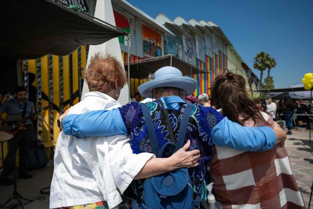 Migrant mothers attend a mass service during Mother's Day at the Mexico-US border in Playas de Tijuana, Baja California state, Mexico on May 10, 2026. (Photo by Guillermo Arias / AFP)