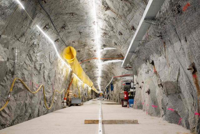 This photograph taken on April 29, 2026 shows a view of the BedrettoLab tunnel, a unique underground research facility operated by the Federal Institute of Technology Zurich (ETH Zurich) located 1500m beneath the Swiss Alps within a 5.2 km tunnel near Bedretto. Researchers have made the ground shake triggering thousands of tiny earthquakes in a monitored setting, as they seek to discover seismicity insights that can reduce risks. (Photo by Ennio LEANZA / AFP)