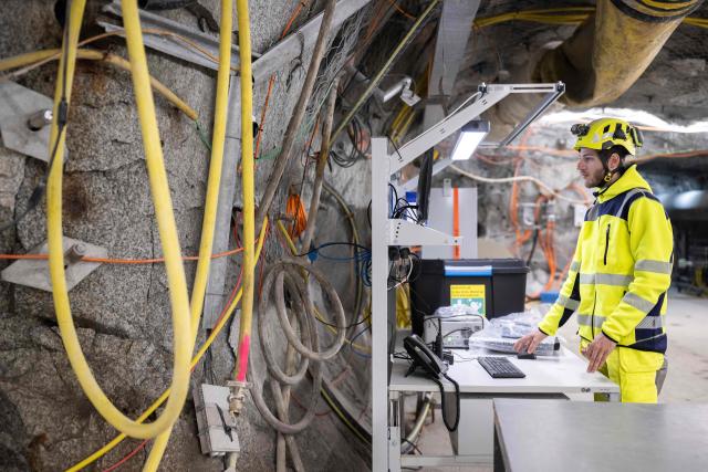 Lab manager Marian Hertrich monitors the measurements on a computer inside the BedrettoLab, a unique underground research facility operated by the Federal Institute of Technology Zurich, located 1500m beneath the Swiss Alps within a 5.2 km tunnel near Bedretto, on April 29, 2026. Researchers have made the ground shake triggering thousands of tiny earthquakes in a monitored setting, as they seek to discover seismicity insights that can reduce risks. (Photo by Ennio LEANZA / AFP)