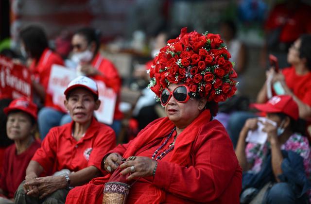 Supporters of Thailand's former prime minister Thaksin Shinawatra wait ahead of his expected release at Klong Prem Central Prison in Bangkok on May 11, 2026. Thailand's former prime minister Thaksin Shinawatra was set to be released early from prison on May 11, raising the prospect of a return to the spotlight for the political heavyweight. (Photo by ANTHONY WALLACE / AFP)