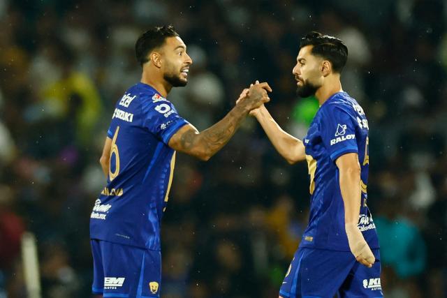 Pumas' Spanish defender #05 Ruben Duarte celebrates after scoring the opening goal with teammate Brazilian defender #06 Nathan Silva during the Liga MX Clausura quarter-final second leg football match between Pumas and America at Olimpico Universitario stadium in Mexico City on May 10, 2026. (Photo by Rodrigo Oropeza / AFP)