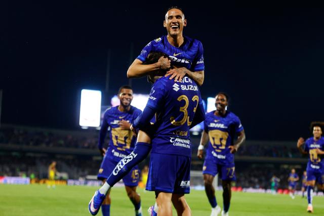 Pumas' midfielder #33 Jordan Carrillo celebrates after scoring his team's third goal with midfielder #21 Uriel Antuna (top) during the Liga MX Clausura quarter-final second leg football match between Pumas and America at Olimpico Universitario stadium in Mexico City on May 10, 2026. (Photo by Rodrigo Oropeza / AFP)