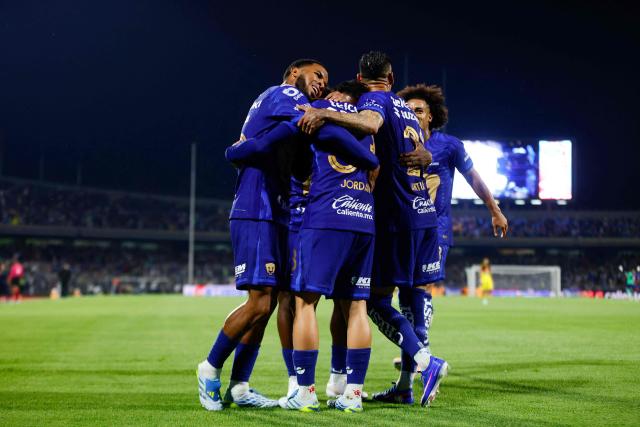 Pumas players celebrate their third goal during the Liga MX Clausura quarter-final second leg football match between Pumas and America at Olimpico Universitario stadium in Mexico City on May 10, 2026. (Photo by Rodrigo Oropeza / AFP)