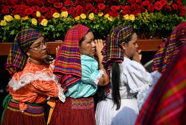 Faithfuls attend the celebration of the Brotherhood of Flowers and Palms in the indigenous town of Panchimalco, El Salvador on May 10, 2026. This year, the traditional religious and cultural festivity is being held following El Salvador’s first inscription on UNESCO's Representative List of the Intangible Cultural Heritage of Humanity announced on December 10, 2025. (Photo by Marvin RECINOS / AFP)