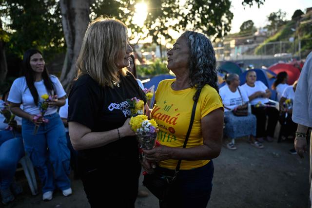 Women take part in a demonstration to demand the release of political prisoners on Mother's Day outside El Rodeo I prison in Guatire, Miranda state, Venezuela on May 10, 2026. (Photo by Juan BARRETO / AFP)