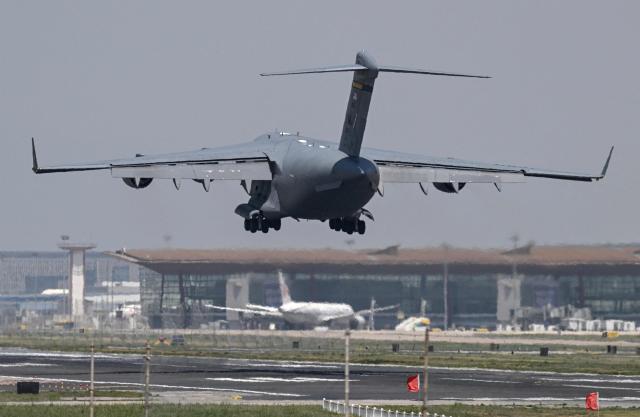 A US Air Force C-17 lands at Beijing Capital Airport in Beijing on May 11, 2026, ahead of a visit by U.S. President Donald Trump. President Donald Trump will visit China from May 13 to 15, with the US leader expected to discuss Iran and trade with his Chinese counterpart. (Photo by GREG BAKER / AFP)