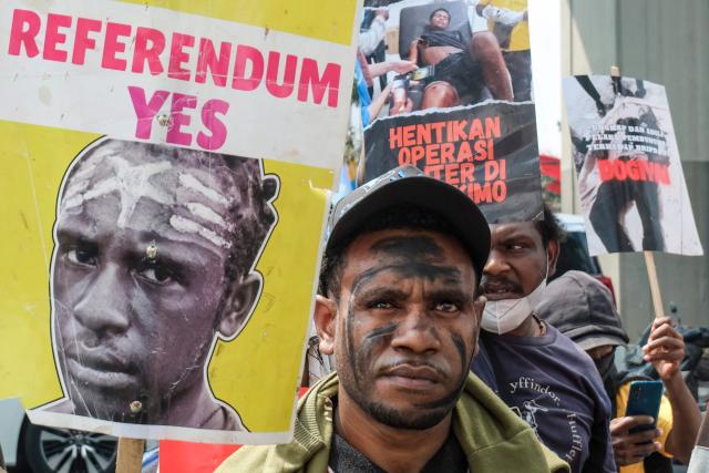 Papuan students take part in a protest demanding a thorough investigation into alleged human rights violations against local residents and calling for an end to military operations in Indonesia’s Papua region, in front of the Ministry of Law and Human Rights in Jakarta on May 11, 2026. (Photo by BAY ISMOYO / AFP)