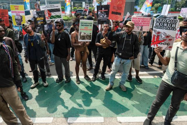 Papuan students take part in a protest demanding a thorough investigation into alleged human rights violations against local residents and calling for an end to military operations in Indonesia’s Papua region, in front of the Ministry of Law and Human Rights in Jakarta on May 11, 2026. (Photo by BAY ISMOYO / AFP)