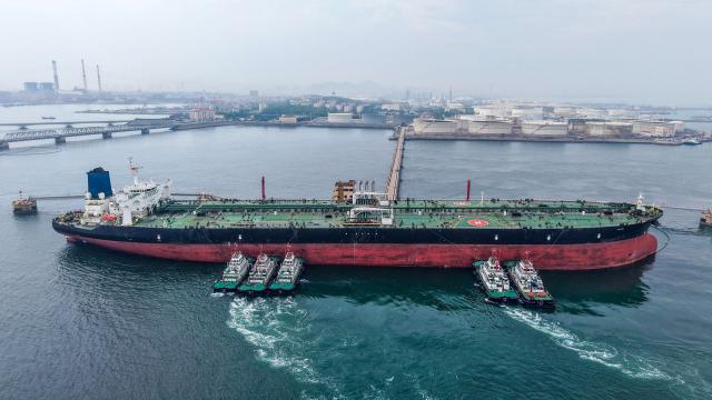 A cargo ship unloads imported crude oil at the Qingdao crude oil terminal in China’s eastern Shandong province on May 11, 2026. (Photo by CN-STR / AFP) / China OUT