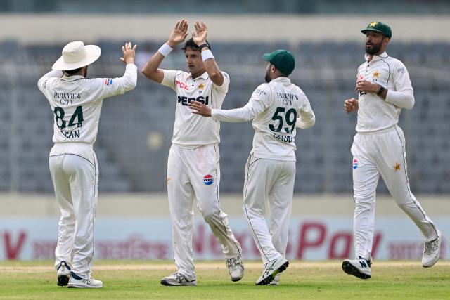 Pakistan's Mohammad Abbas (2L) celebrates with teammates after taking the wicket of Bangladesh's Mahmudul Hasan Joy during the fourth day of the first Test cricket match between Bangladesh and Pakistan at the Sher-e-Bangla National Stadium in Mirpur on May 11, 2026. (Photo by Munir UZ ZAMAN / AFP)