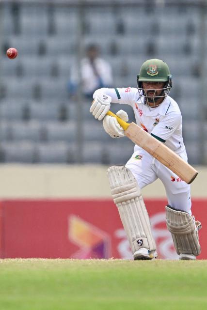 Bangladesh's Mominul Haque plays a shot during the fourth day of the first Test cricket match between Bangladesh and Pakistan at the Sher-e-Bangla National Stadium in Mirpur on May 11, 2026. (Photo by Munir UZ ZAMAN / AFP)