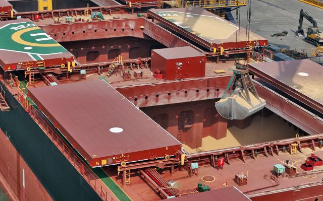 A batch of soybeans imported from Brazil is being unloaded from a ship at a grain terminal in Yantai, in eastern China's Shandong province on May 11, 2026. (Photo by CN-STR / AFP) / China OUT