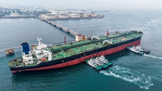 A cargo ship unloads imported crude oil at the Qingdao crude oil terminal in China’s eastern Shandong province on May 11, 2026. (Photo by CN-STR / AFP) / China OUT