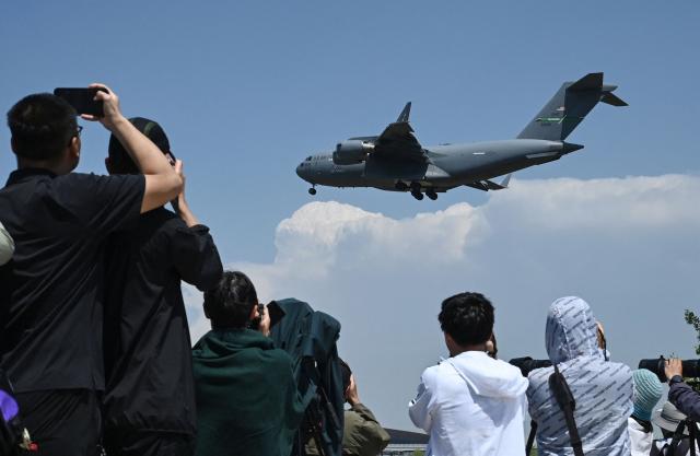 A US Air Force C-17 lands at Beijing Capital Airport in Beijing on May 11, 2026, ahead of a visit by U.S. President Donald Trump. President Donald Trump will visit China from May 13 to 15, with the US leader expected to discuss Iran and trade with his Chinese counterpart. (Photo by GREG BAKER / AFP)