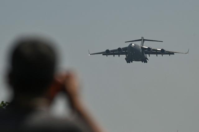 A US Air Force C-17 lands at Beijing Capital Airport in Beijing on May 11, 2026, ahead of a visit by US President Donald Trump. President Donald Trump will visit China from May 13 to 15, with the US leader expected to discuss Iran and trade with his Chinese counterpart. (Photo by GREG BAKER / AFP)