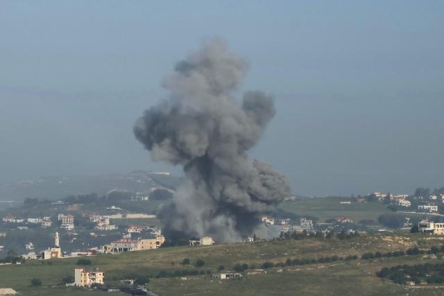 A photograph taken from the southern Lebanese area of Marjeyoun shows smoke as it rises from the site of an Israeli airstrike that targeted the village of Kfar Tibnit on May 11, 2026. Lebanon was drawn into the Middle East war on March 2 when Tehran-backed militant group Hezbollah launched attacks on Israel to avenge the killing of the Iranian leader. Israel has responded with broad strikes across Lebanon and a ground offensive. Lebanon's health ministry on May 10, 2026, raised the overall death toll from Israeli strikes since war erupted to 2,846 killed, including 108 health and emergency workers. (Photo by AFP)