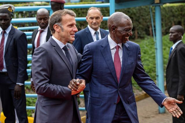 French President Emmanuel Macron (L) is received by Kenya's President William Ruto (R) as he arrives to take part in the youth session Africa Forward: Future Makers during the Africa Forward summit in Nairobi on May 11, 2026. (Photo by Tony KARUMBA / AFP)