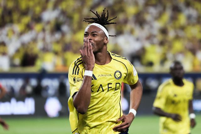 TOPSHOT - Nassr's French defender #03 Mohamed Simakan celebrates after scoring his team's first goal during the Saudi Pro League football match between Al-Nassr and Al-Hilal at King Fahd Sports City Stadium in Riyadh on May 12, 2026. (Photo by Fayez Nureldine / AFP)