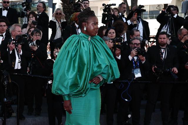 Senegalese director and screenwriter Angele Diabang arrives for the Opening Ceremony and the screening of the film "La Venus electrique" (The Electric Kiss) at the 79th edition of the Cannes Film Festival in Cannes, southern France, on May 12, 2026. (Photo by Thibaud MORITZ / AFP)