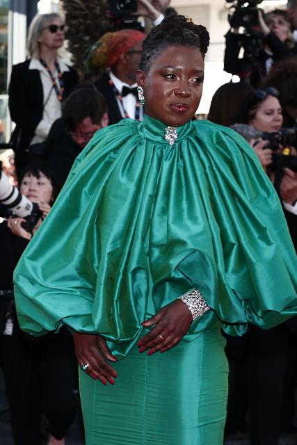Senegalese director and screenwriter Angele Diabang arrives for the Opening Ceremony and the screening of the film "La Venus electrique" (The Electric Kiss) at the 79th edition of the Cannes Film Festival in Cannes, southern France, on May 12, 2026. (Photo by Thibaud MORITZ / AFP)