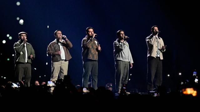 Portuguese singers Miguel Costa, Duarte Farias, Francisco Raposo, Luis Aleixo and Francisco Pestana of band Bandidos do Cante and representing Portugal with the song 'Rosa' perform during the first semi-final of the Eurovision Song Contest 2026 (ESC) at Wiener Stadthalle in Vienna, Austria on May 12, 2026. (Photo by Tobias SCHWARZ / AFP)