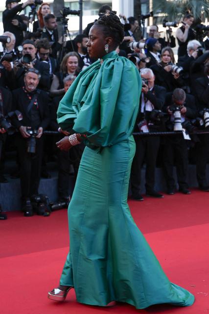 Member of the jury "Un Certain Regard" and Senegalese producer and director Angele Diabang arrives for the Opening Ceremony and the screening of the film "La Venus electrique" (The Electric Kiss) at the 79th edition of the Cannes Film Festival in Cannes, southern France, on May 12, 2026. (Photo by Sameer AL-DOUMY / AFP)