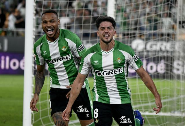 Real Betis' Spanish midfielder #08 Pablo Fornals celebrates scoring his team's second goal during the Spanish league football match between Real Betis and Elche CF at Benito Villamarin Stadium in Seville on May 12, 2026. (Photo by CRISTINA QUICLER / AFP)