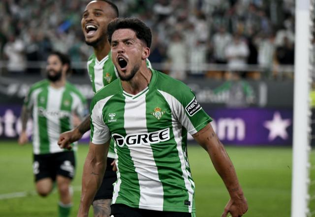 Real Betis' Spanish midfielder #08 Pablo Fornals celebrates scoring his team's second goal during the Spanish league football match between Real Betis and Elche CF at Benito Villamarin Stadium in Seville on May 12, 2026. (Photo by CRISTINA QUICLER / AFP)