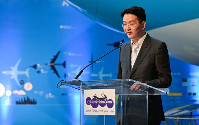 Walter Cho, Chairman and CEO of Korean Air and Hanjin Group, addresses attendees inside the Korean Air Aviation Gallery at the future Samuel Oschin Air and Space Center at the California Science Center in Los Angeles, California, on May 12, 2026, following the installation of the first artifacts in the aviation gallery. (Photo by Frederic J. BROWN / AFP)