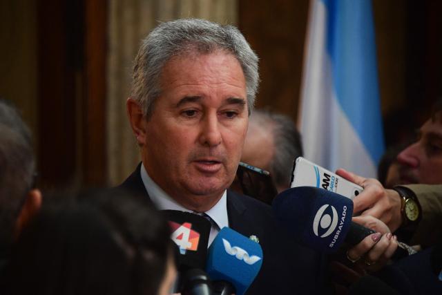 Argentina's Minister of Foreign Affairs, Pablo Quirno, speaks with the media after a bilateral meeting with Uruguay's Minister of Foreign Affairs, Mario Lubetkin (out of frame), in Montevideo on May 12, 2026. (Photo by Dante FERNANDEZ / AFP)