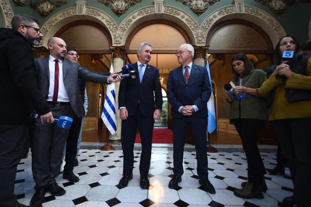 Uruguay's Minister of Foreign Affairs, Mario Lubetkin (R), and Argentina's Minister of Foreign Affairs, Pablo Quirno, speak with the media after a bilateral meeting at the Palacio Santos in Montevideo on May 12, 2026. (Photo by Dante FERNANDEZ / AFP)