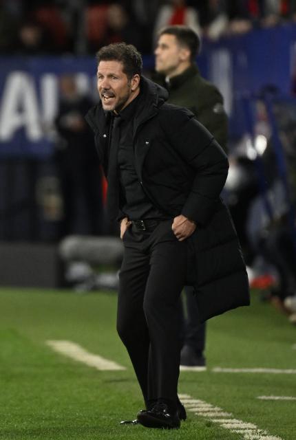 Atletico Madrid's Argentine coach Diego Simeone shouts instructions to his players from the touchline during the Spanish league football match between CA Osasuna and Club Atletico de Madrid at El Sadar Stadium in Pamplona on May 12, 2026. (Photo by ANDER GILLENEA / AFP)