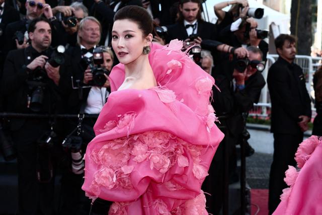 Chinese singer Chang Sisi arrives for the Opening Ceremony and the screening of the film "La Venus electrique" (The Electric Kiss) at the 79th edition of the Cannes Film Festival in Cannes, southern France, on May 12, 2026. (Photo by Thibaud MORITZ / AFP)