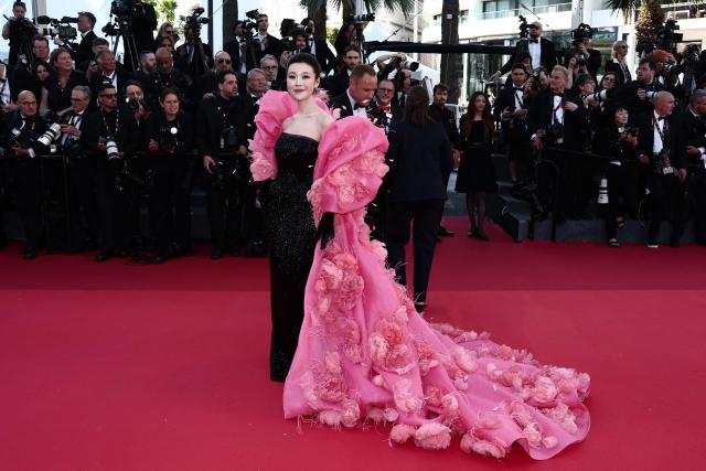 Chinese singer Chang Sisi arrives for the Opening Ceremony and the screening of the film "La Venus electrique" (The Electric Kiss) at the 79th edition of the Cannes Film Festival in Cannes, southern France, on May 12, 2026. (Photo by Thibaud MORITZ / AFP)