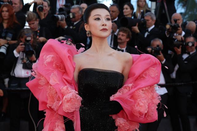 Chinese singer Chang Sisi arrives for the Opening Ceremony and the screening of the film "La Venus electrique" (The Electric Kiss) at the 79th edition of the Cannes Film Festival in Cannes, southern France, on May 12, 2026. (Photo by Valery HACHE / AFP)