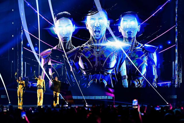 Georgian singers Giorgi Shiolashvili, Mariam Tatulashvili and Mariam Kikuashvili of band Bzikebi and representing Georgia with the song 'On Replay' perform during the first semi-final of the Eurovision Song Contest 2026 (ESC) at Wiener Stadthalle in Vienna, Austria on May 12, 2026. (Photo by Tobias SCHWARZ / AFP)