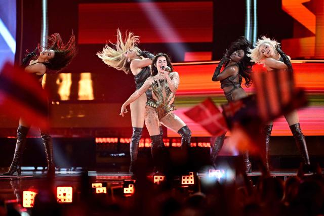 German singer Sarah Engels (C), representing Germany with the song 'Fire', performs during the first semi-final of the Eurovision Song Contest 2026 (ESC) at Wiener Stadthalle in Vienna, Austria on May 12, 2026. (Photo by Tobias SCHWARZ / AFP)