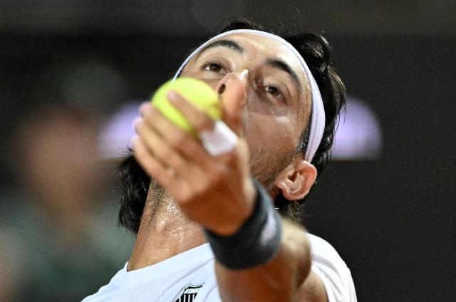 Argentina's Thiago Agustin Tirante serves to Russia's Daniil Medvedev during the ATP Rome Open tennis tournament at Foro Italico in Rome on May 12, 2026. (Photo by Tiziana FABI / AFP)
