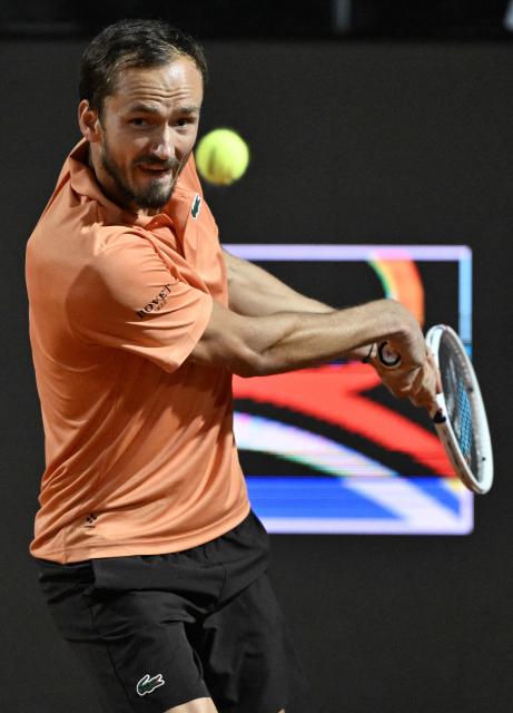 Russia's Daniil Medvedev hits a return to Argentina's Thiago Agustin Tirante during the ATP Rome Open tennis tournament at Foro Italico in Rome on May 12, 2026. (Photo by Tiziana FABI / AFP)