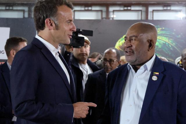 France's President Emmanuel Macron (L) speaks with Comoros' President Assoumani Azali at the end of their bilateral meeting during the Africa Forward summit in Nairobi on May 12, 2026. (Photo by Ludovic MARIN / AFP)