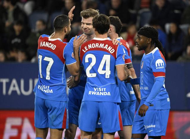 Atletico Madrid's Norwegian forward #09 Alexander Sorloth (2L) celebrates scoring his team's second goal with teammates during the Spanish league football match between CA Osasuna and Club Atletico de Madrid at El Sadar Stadium in Pamplona on May 12, 2026. (Photo by ANDER GILLENEA / AFP)
