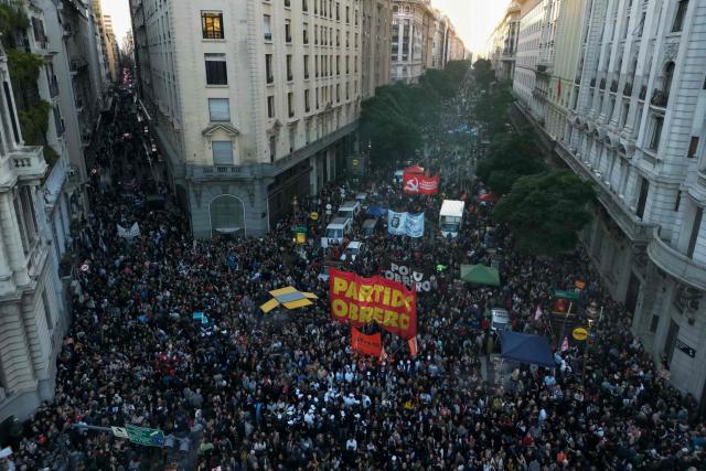 This aerial view shows university students and workers marching as they take part in a protest at Plaza de Mayo against the Javier Milei government's policies in Buenos Aires on May 12, 2026. (Photo by Luis ROBAYO / AFP)