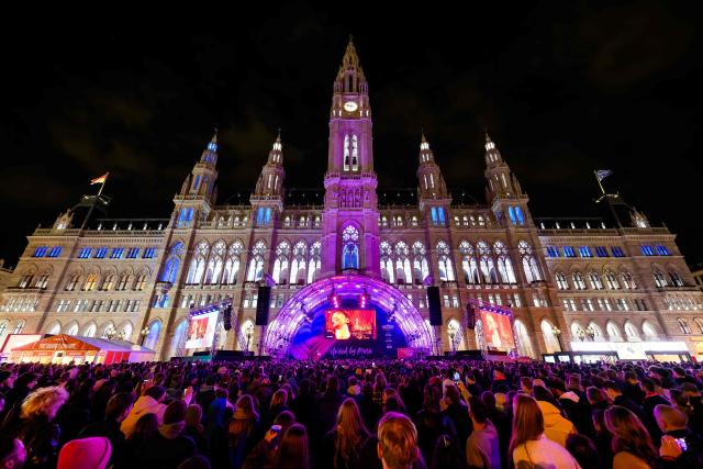 Spectators gather at the fan area at City Hall Square (Rathausplatz) during the first semi-final of the Eurovision Song Contest (ESC) in Vienna, Austria on May 12, 2026. (Photo by MAX SLOVENCIK / APA / AFP) / Austria OUT