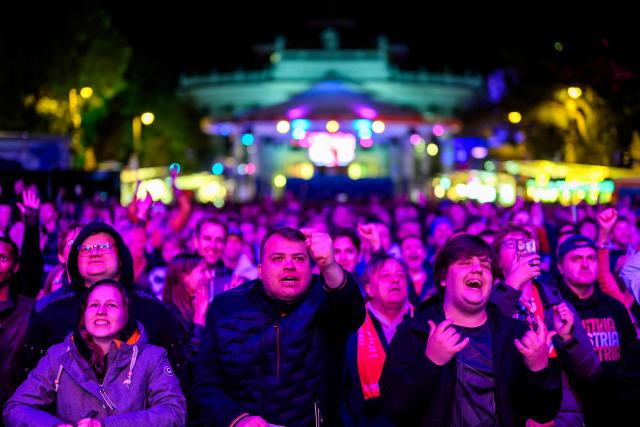 Spectators react at the fan area at City Hall Square (Rathausplatz) during the first semi-final of the Eurovision Song Contest (ESC) in Vienna, Austria on May 12, 2026. (Photo by MAX SLOVENCIK / APA / AFP) / Austria OUT