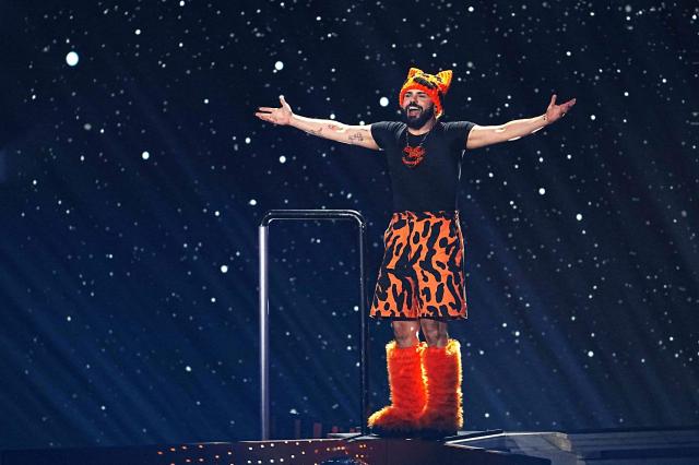 Greek singer Akylas Mytilinaios, aka Akylas and representing Greece with the song 'Ferto', performs during the first semi-final of the Eurovision Song Contest 2026 (ESC) at Wiener Stadthalle in Vienna, Austria on May 12, 2026. (Photo by GEORG HOCHMUTH / APA / AFP) / Austria OUT
