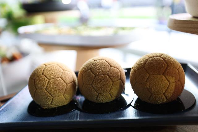 Soccer ball desserts for inclusive hospitality package guests are displayed during the 30 Days to FIFA World Cup 2026 media event at SoFI Stadium before the pitch installation and temporary renaming to Los Angeles Stadium in Inglewood, California on May 12, 2026. The US Men's National Team will play their first 2026 FIFA World Cup match on June 12 against Paraguay. (Photo by Patrick T. Fallon / AFP)